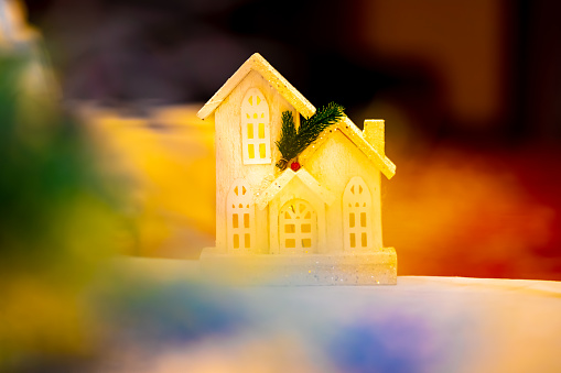 House toy. Christmas house on colorful background