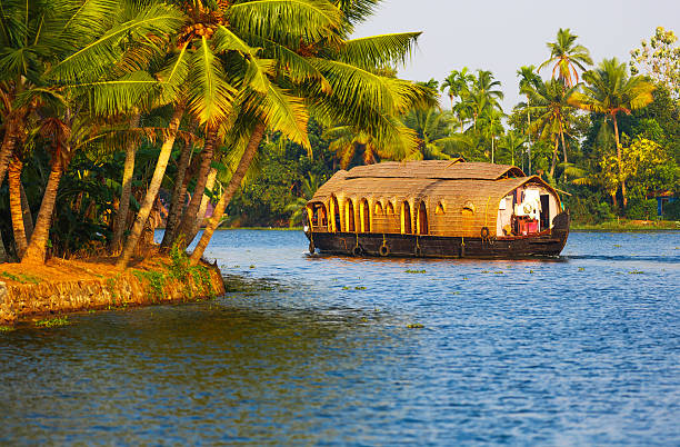 Houseboat in Kerala Houseboat on Kerala backwaters - India kerala stock pictures, royalty-free photos & images