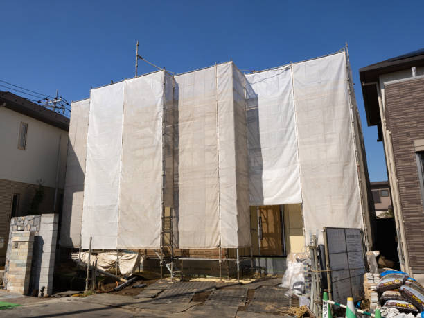 A housing construction site covered with sheets. stock photo