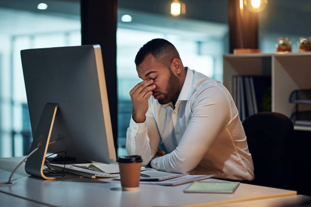 How did I not see this deadline coming? Shot of a young businessman experiencing stress during late night at work frustration stock pictures, royalty-free photos & images