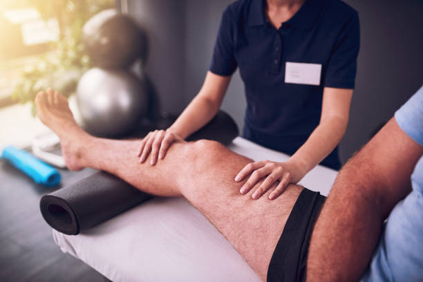 How is this knee progressing Cropped shot of an unrecognizable female physiotherapist treating a male patient osteoarthritis stock pictures, royalty-free photos & images