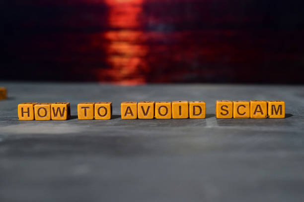 How to avoid scam? on wooden blocks How to avoid scam? on wooden blocks. Cross processed image with bokeh background avoidance stock pictures, royalty-free photos & images