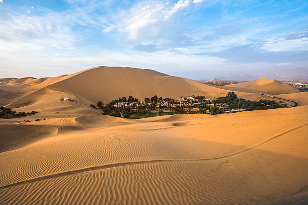 Hucachina oasis in sand dunes near Ica, Peru stock photo
