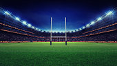 istock huge rugby stadium with fans and green grass 1056806530