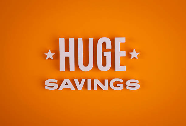 Huge Savings sign lettering stock photo