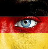 Human face painted with flag of Germany