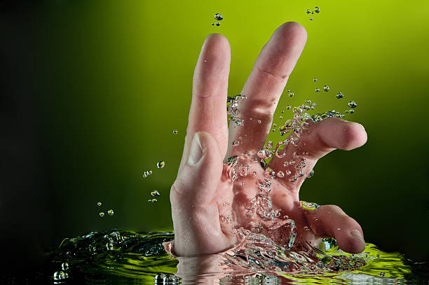 human hand entering another dimension, bubbles stock photo