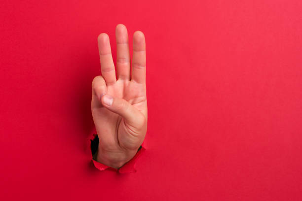 Human hand showing number three stock photo