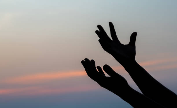 Human hands open palm up worship. stock photo