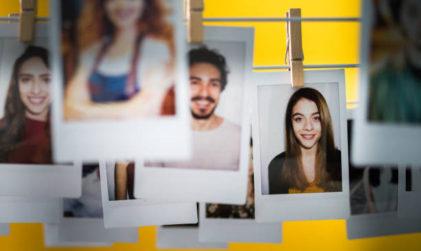 Human resources Polaroid photos of different people hanged with clothespins on a wire. choice photos stock pictures, royalty-free photos & images
