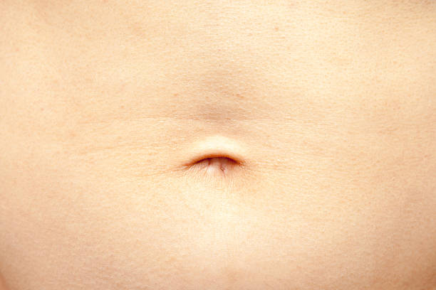 Human tummy and belly button stock photo