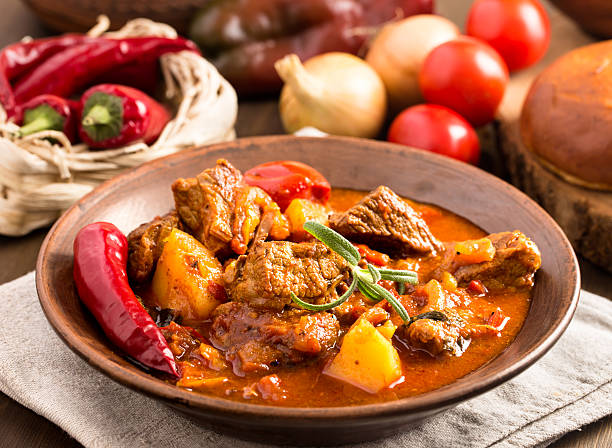 Hungarian goulash in plate Goulash in ceramic plate. Traditional hungarian meal. hungary stock pictures, royalty-free photos & images