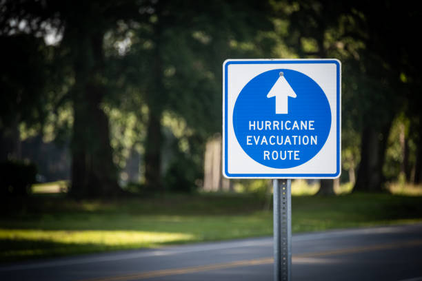 Hurricane Evacuation Route Directional Sign A sign leads Hurricane evacuees to safety. evacuation stock pictures, royalty-free photos & images