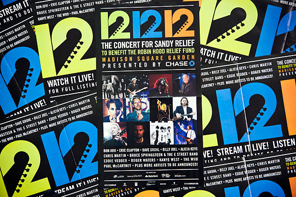 Hurricane Sandy # 5 XXXL "New York City, USA - December 21, 2012: Posters with the announcement of the 121212 Concert for Sandy Relief in Madison Square Garden. These posters were a couple days the cover of the free newspaper AM New York availbale in many street boxes. There were performances by Bon Jovi, Eric Clapton, Bruce Springsteen, Paul McCartney and many other artists." bruce springsteen stock pictures, royalty-free photos & images