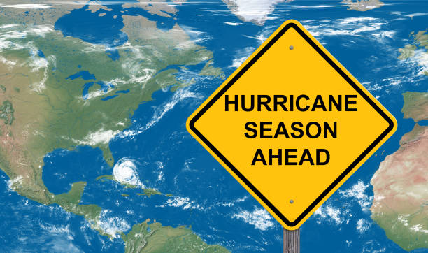 Hurricane Season Warning Sign Hurricane Season Ahead Caution Sign With Satellite Map Background season stock pictures, royalty-free photos & images