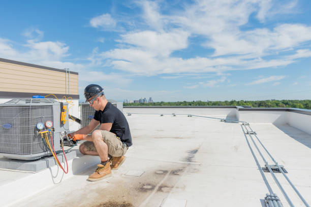 Hvac Tech checking Condenser with Blue Sky Background Hvac technician working on an air conditioning unit with lots of open space technician stock pictures, royalty-free photos & images