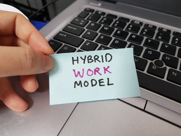 Hybrid work model. Hybrid workplace during covid-19 pandemic stock photo