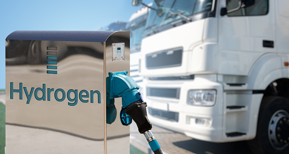 Self service hydrogen filling station on a background of trucks