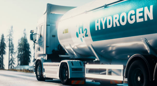 Hydrogen logistics concept. Truck with gas tank trailer on the road lined with solar power plants. 3d rendering stock photo