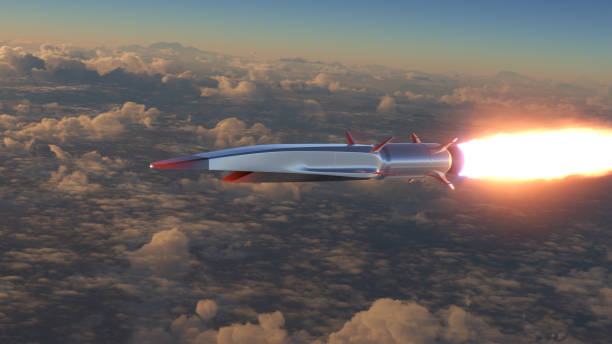 Hypersonic rocket flies above the clouds stock photo