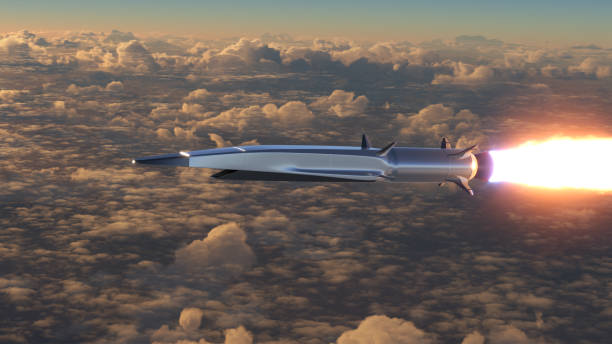 Hypersonic rocket flies above the clouds stock photo