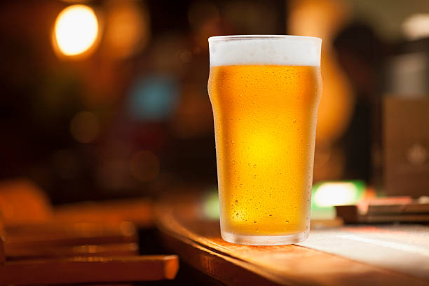 Ice Cold Glass of Beer Covered with water drops condensation stock photo