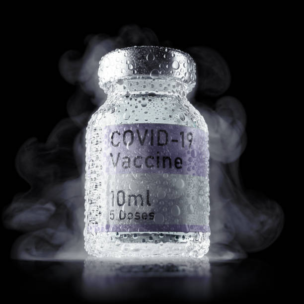 Ice cold vial of refrigerated Covid Vaccine with condensation droplets stock photo