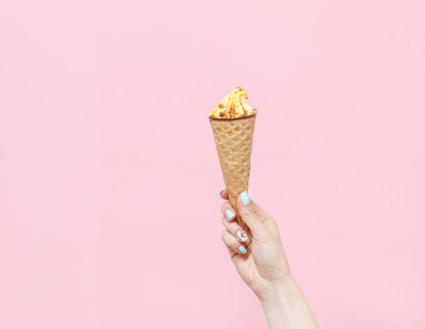 Ice Cream in a waffles cone on color background. stock photo
