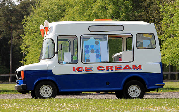 Ice cream van Side view of ice cream van in green countryside ice cream truck stock pictures, royalty-free photos & images