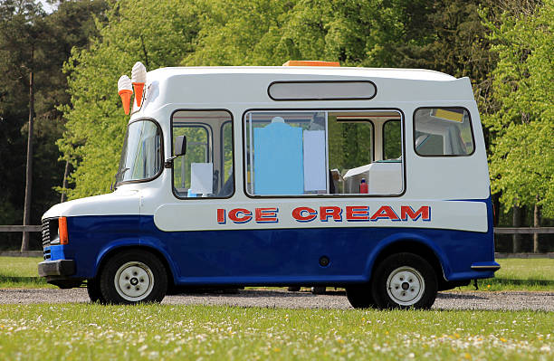 Ice cream van Ice cream van parked in green countryside. ice cream truck stock pictures, royalty-free photos & images