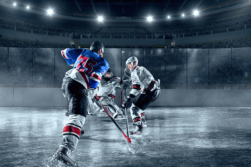 Ice Hockey Players On Big Professional Ice Arena Stock Photo - Download Image Now - iStock