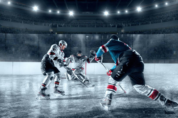 Ice hockey players on big professional ice arena stock photo