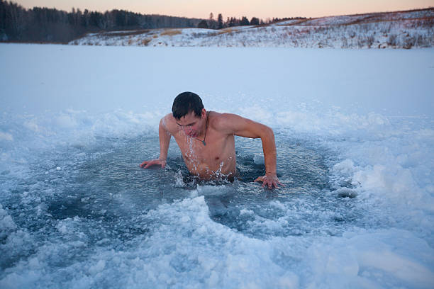ice hole - ice swimming stockfoto's en -beelden