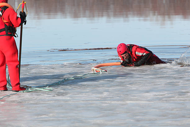 ice water rescuers - havenmeester stockfoto's en -beelden