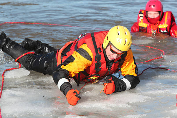 ice water rescuers - havenmeester stockfoto's en -beelden