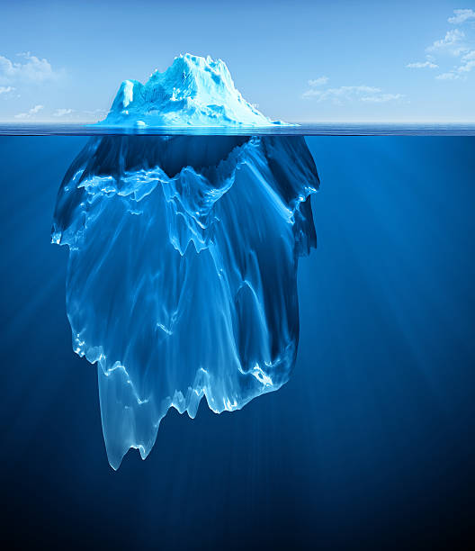 iceberg iceberg floating on clear water iceberg ice formation stock pictures, royalty-free photos & images