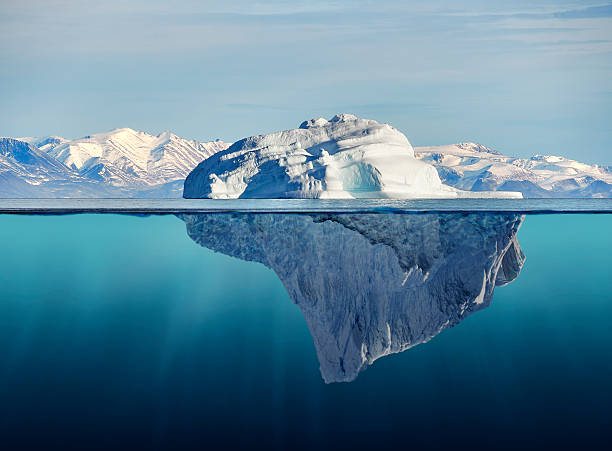 iceberg with above and underwater view - ijsberg stockfoto's en -beelden
