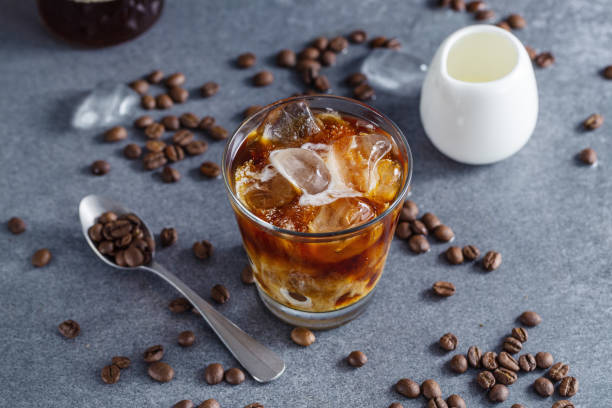 Iced coffee with ice cubes in glass stock photo