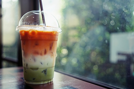 A Iced Three Layers Beverage Consist Of Thai Tea Milk And Green Tea In Plastic Cup With Blurry Bokeh Background Stock Photo Download Image Now Istock,Mole Vs Vole Vs Shrew Vs Mouse