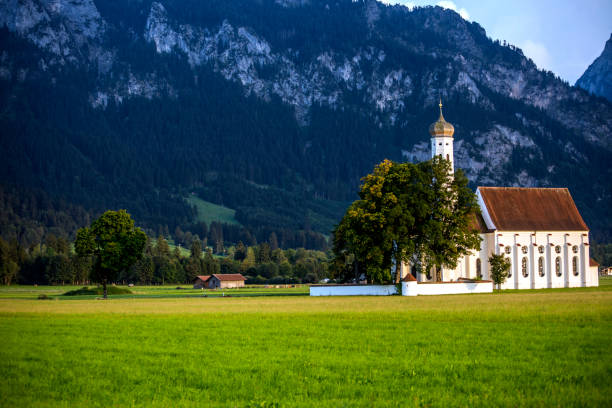 Idyllic St Coloman Church in Allgau, Bavarian Alps at summer, Germany stock photo