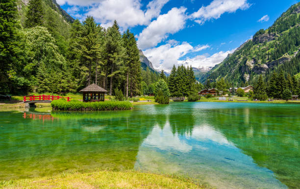 Idyllic summer view at Gressoney-Saint-Jean with the Monterosa in the background. In the Lys Valley. Aosta Valley, northern Italy. stock photo