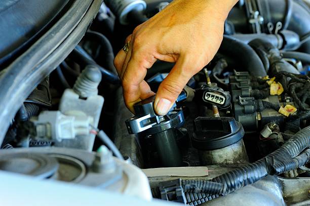 Ignition coil Change Ignition coil of car.. spiral stock pictures, royalty-free photos & images
