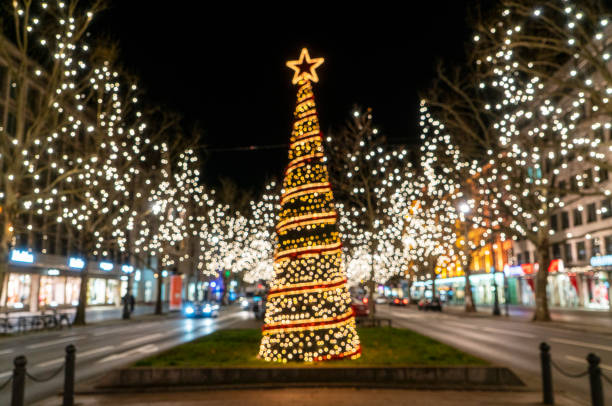 Illuminated Christmas decorations in Berlin at night Illuminated Christmas decorations in Berlin at night central berlin stock pictures, royalty-free photos & images