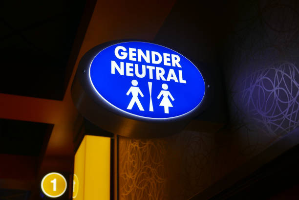 Illuminated gender neutral restroom sign stock photo