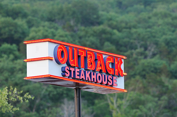 Illuminated Outback Steakhouse sign. stock photo