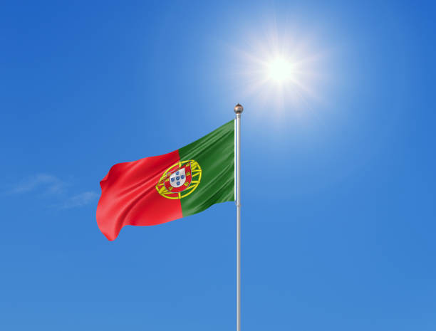 3d illustration. colored waving flag of portugal on sunny blue sky background. - portugal flag imagens e fotografias de stock