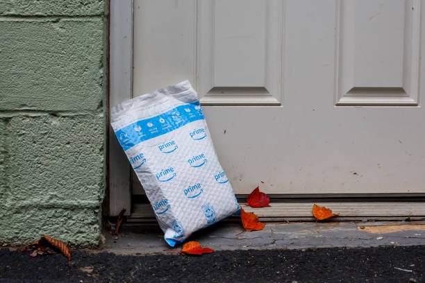 Illustrative images package from Amazon Prime delivery outside next front door stock photo