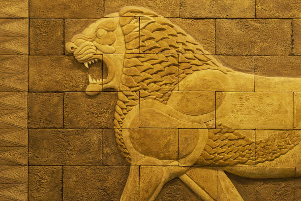 Image of a lion on a yellow porous brick wall in the Sumerian style of ancient Babylon Image of a lion on a yellow porous brick wall in the Sumerian style of ancient Babylon sumerian civilization stock pictures, royalty-free photos & images