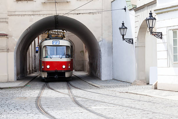 Image of a tram under a bridge in Prague stock photo
