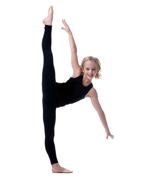 Image of flexible little girl doing vertical split Flexible little girl doing vertical split, isolated on white doing the splits stock pictures, royalty-free photos & images